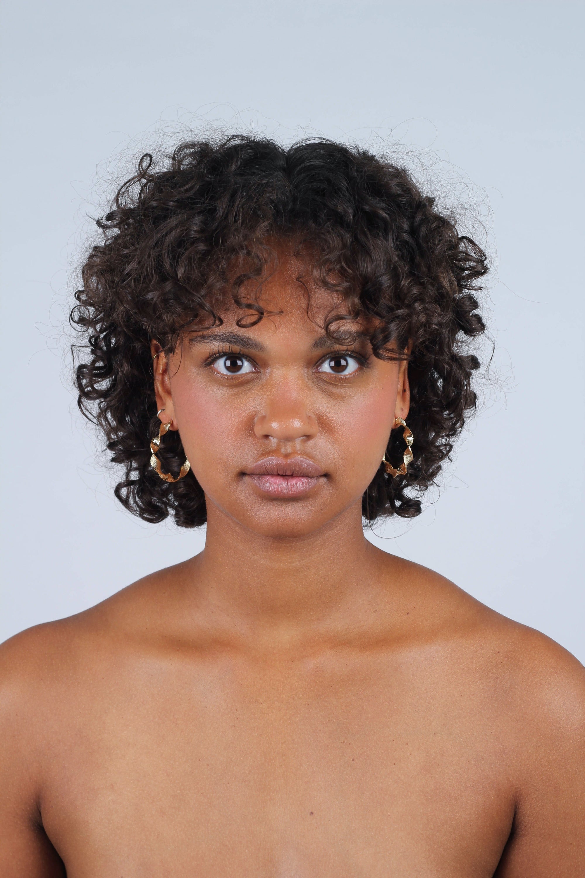 Gold rough smooth twisted hoop earrings_8