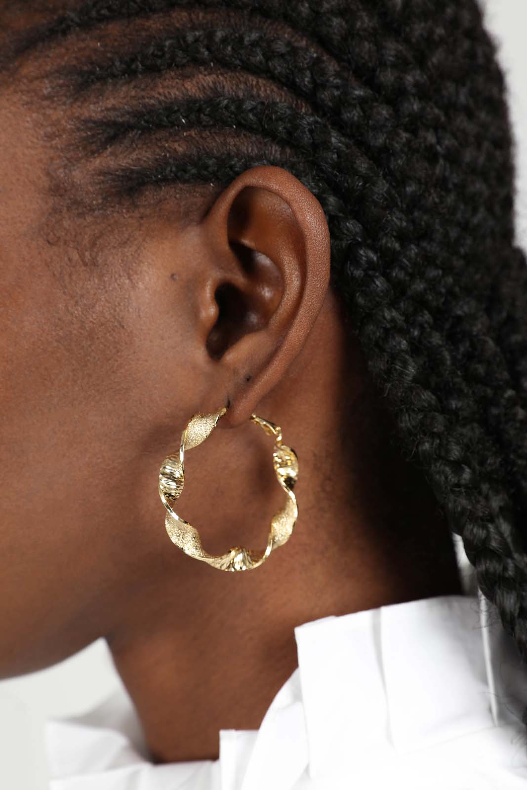 Gold rough smooth twisted hoop earrings_5