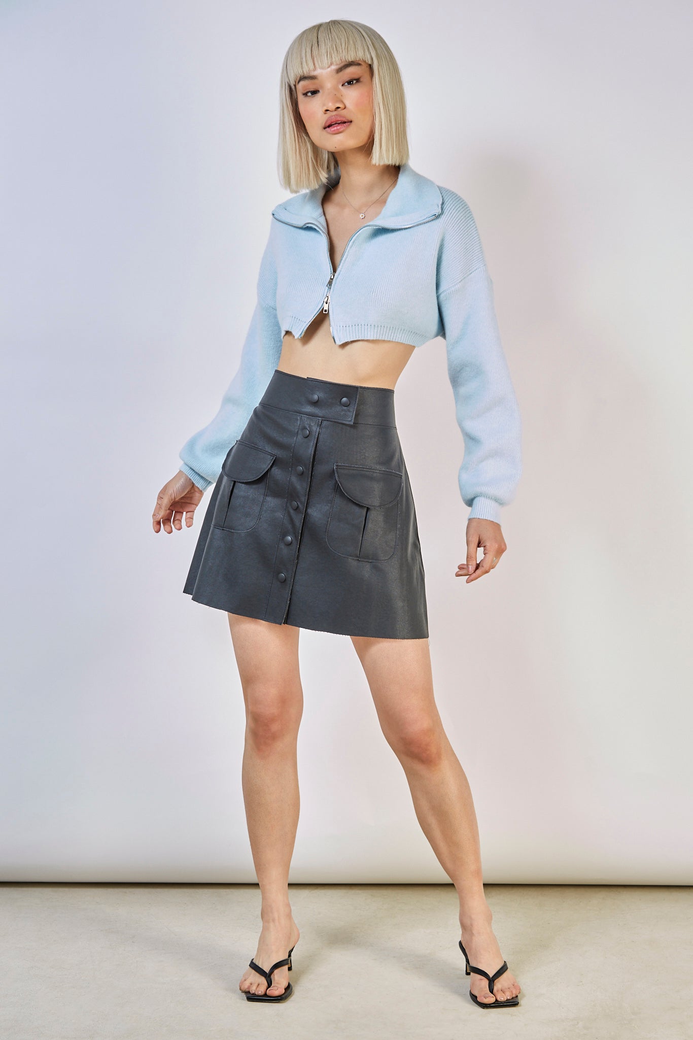 Black vegan leather pocket front mini skirt_1