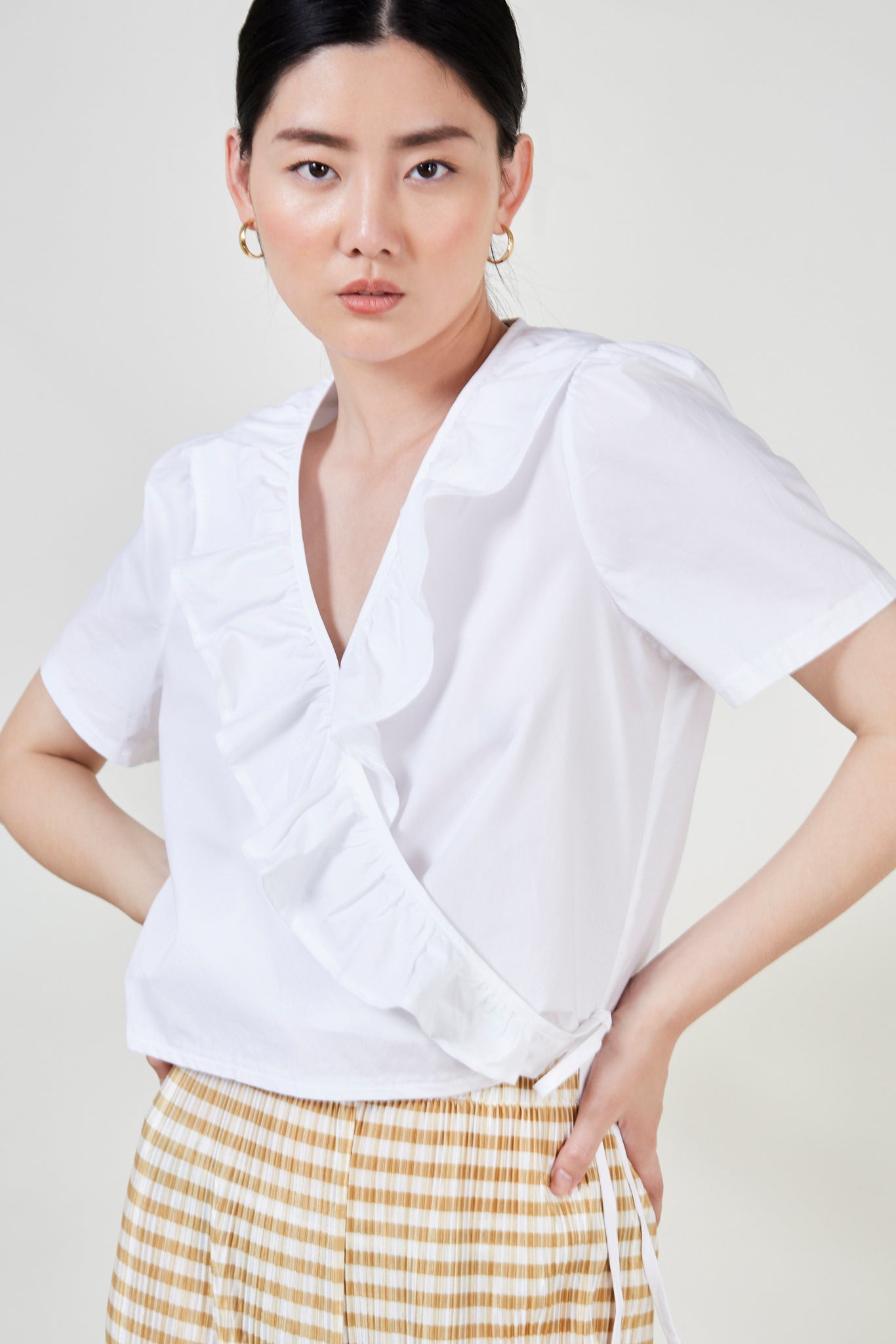Ivory ruffle trim wrap top_1