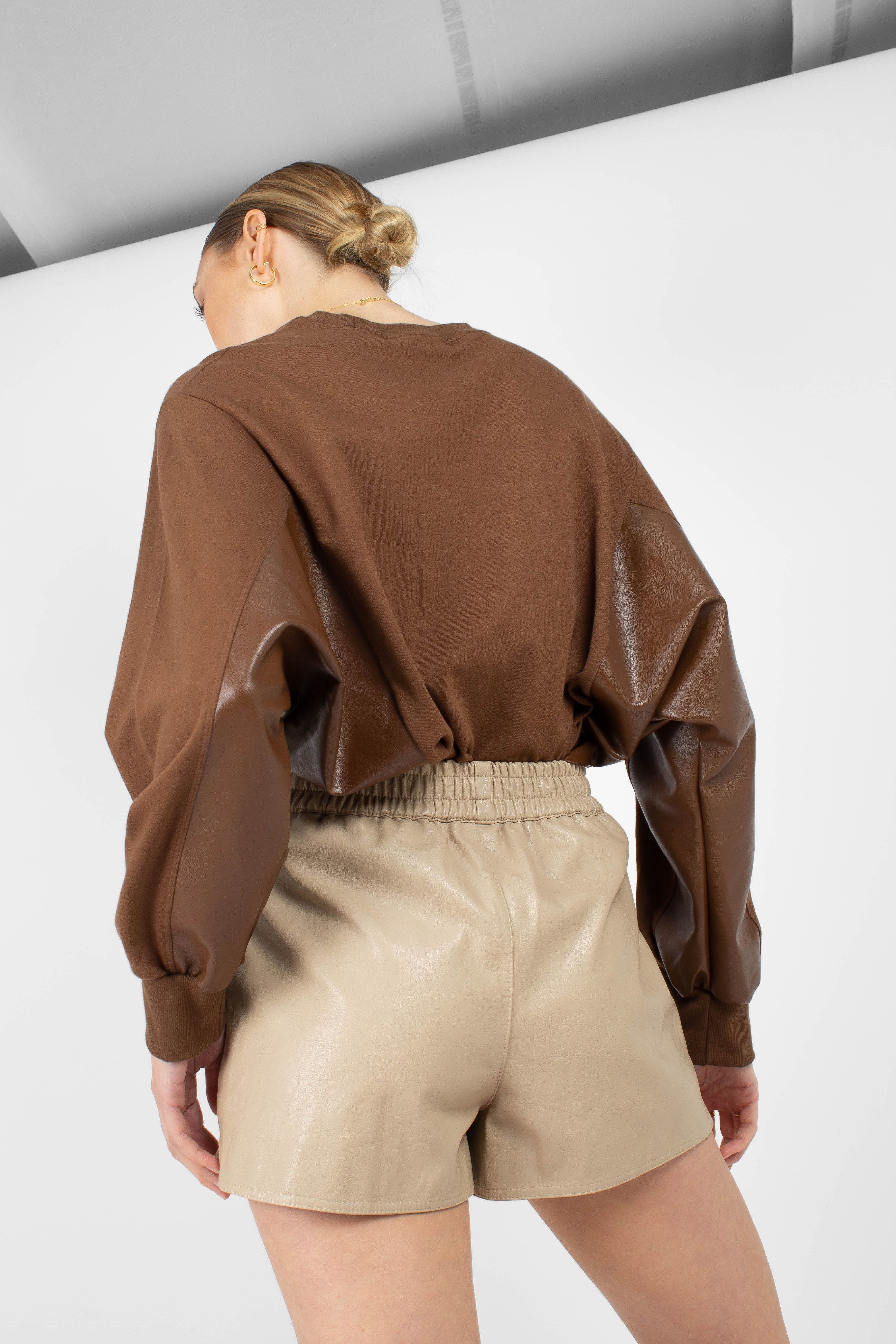 Beige vegan leather running shorts_1