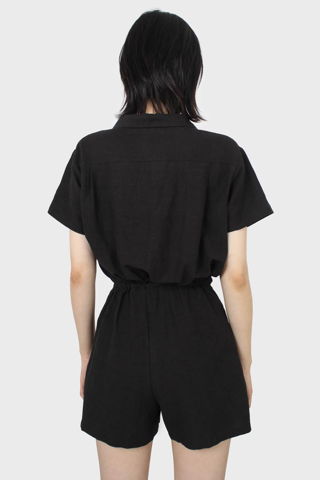 Black short sleeved button up tie waist romper_3