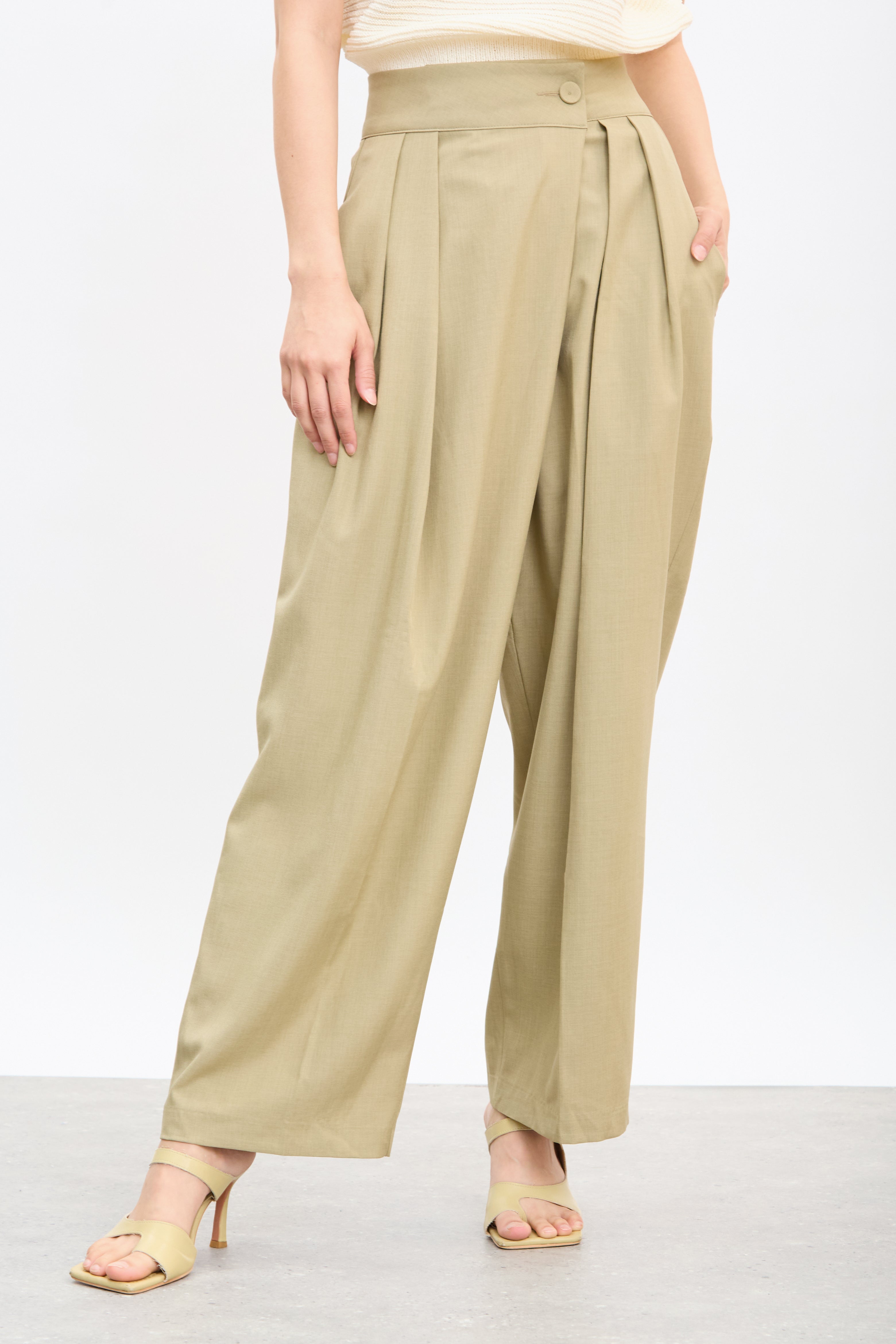 Beige multi pleat side button trousers_1