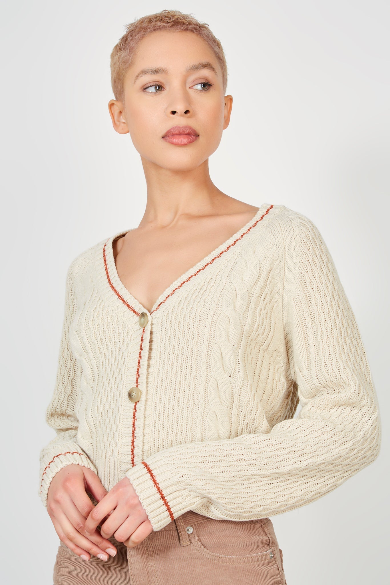 Beige cableknit red trim cardigan_1
