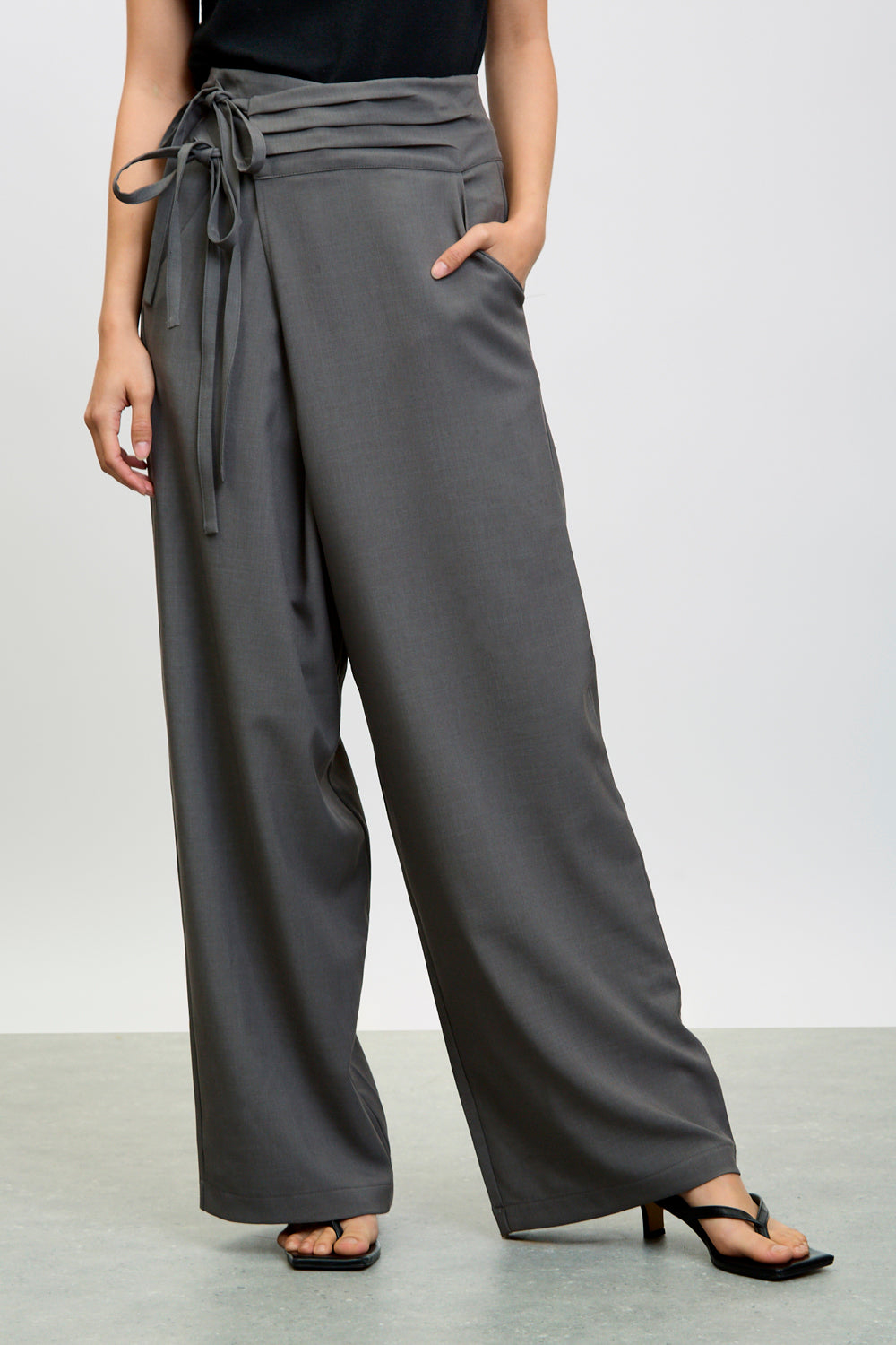 ★2025SS新作★KASHIKO★Pintuck Asymmetric Trousers Charcoal asymmetric tie up trousers | Glassworks London