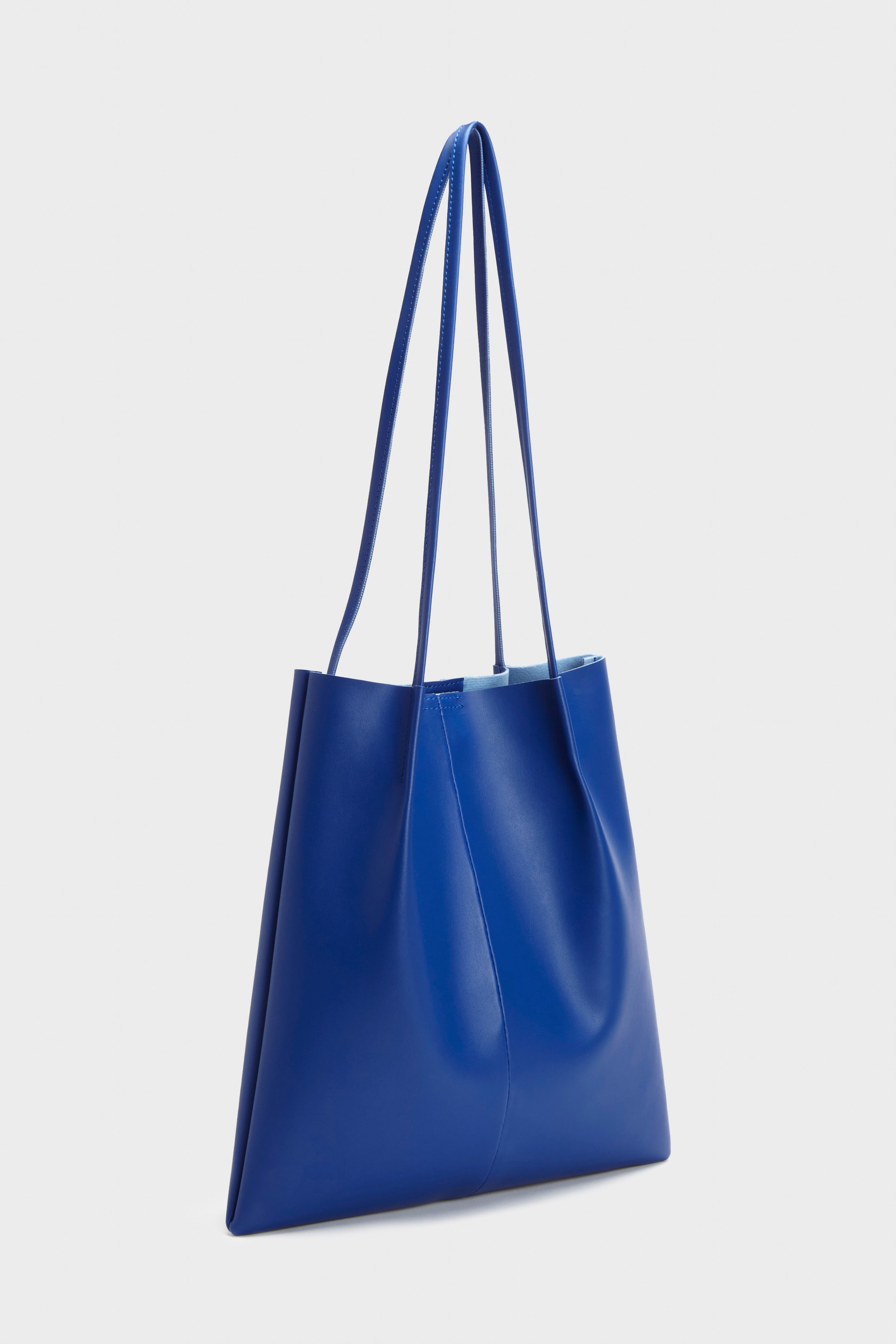 Cobalt blue vegan leather pinched strap tote bag_1