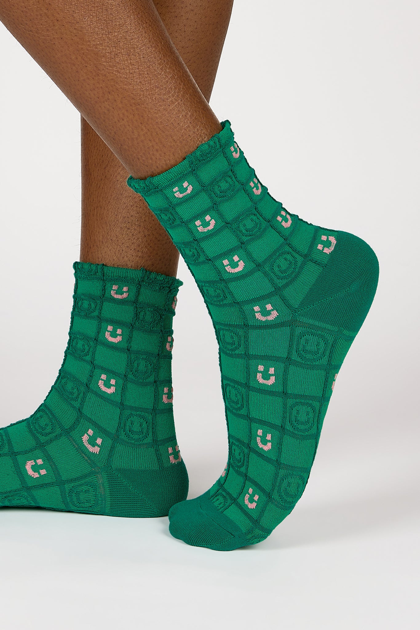 Green and white checked smiley face socks_1