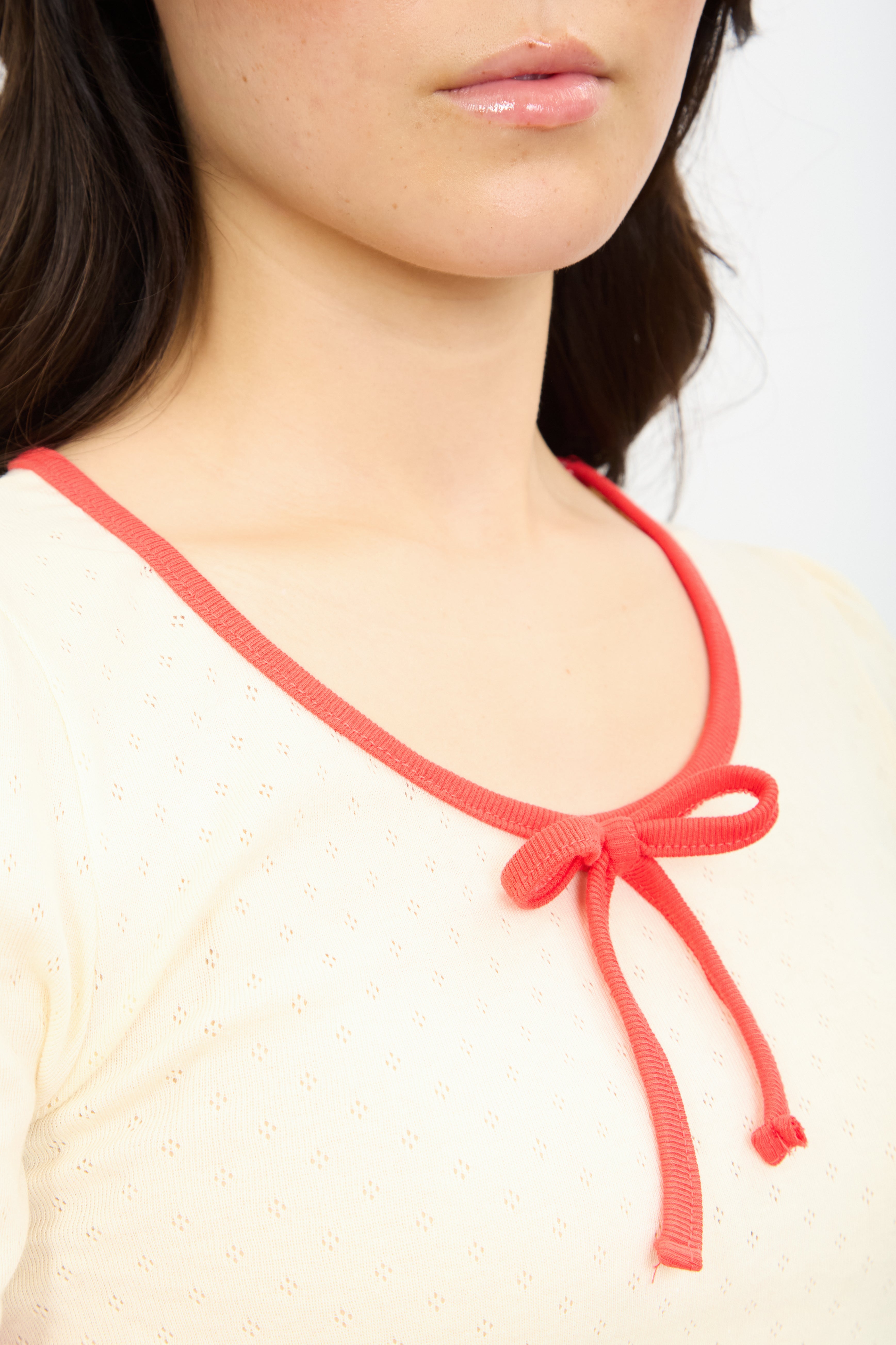 Ivory and red contrast trim bow front tee_3