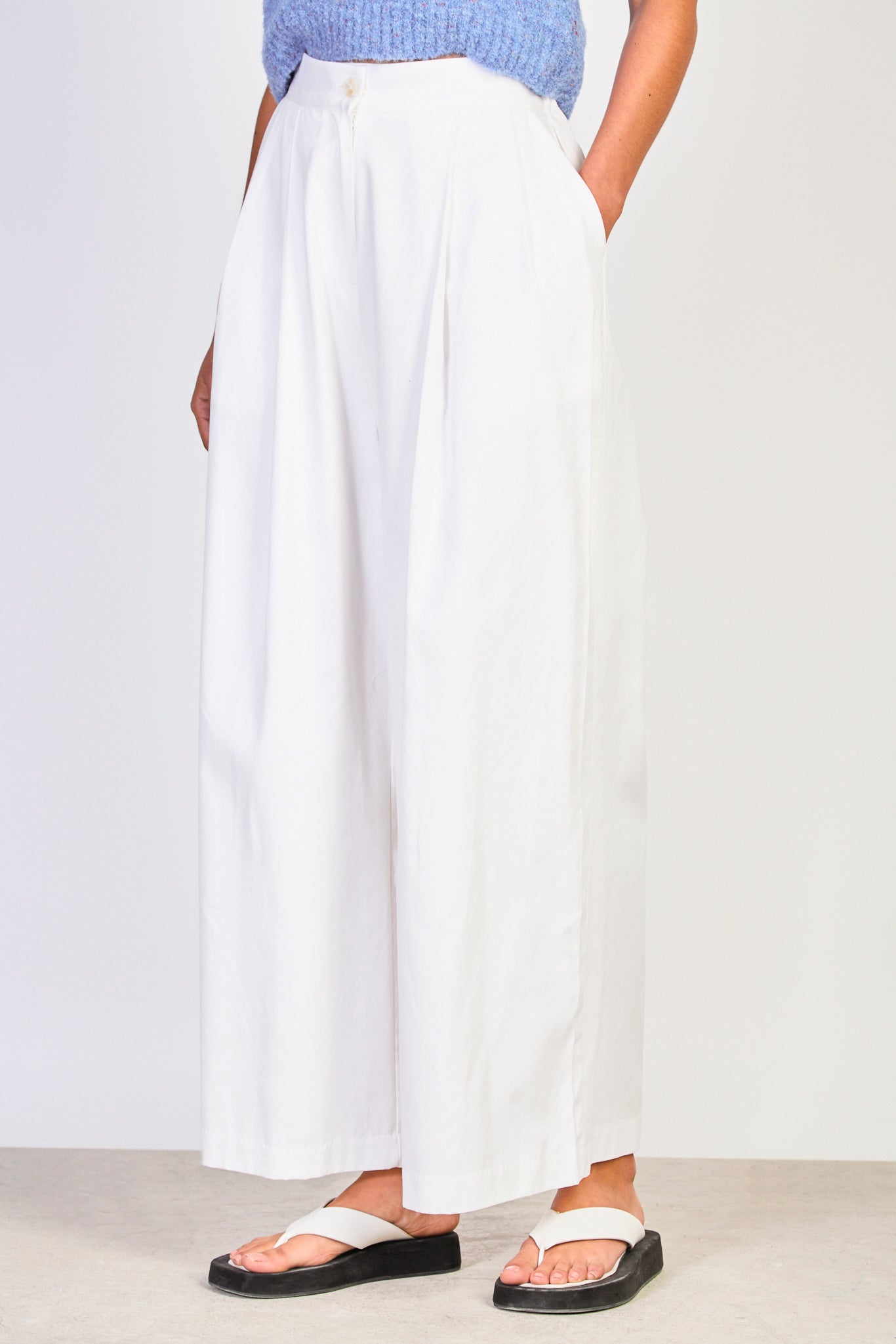 Ivory pleated wide leg trousers_1