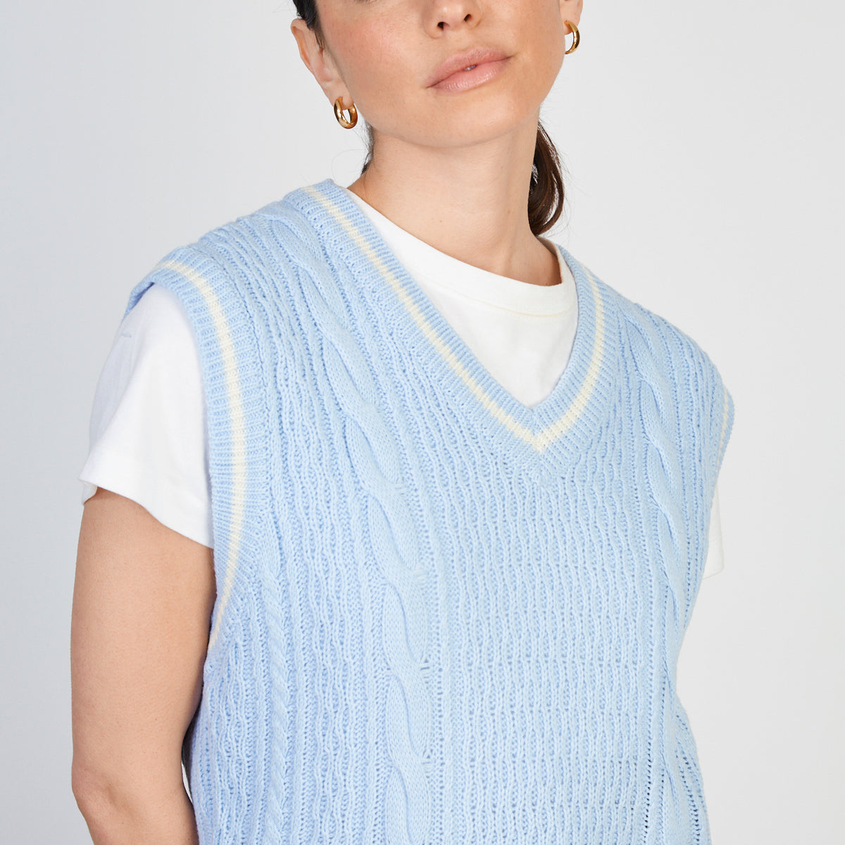 Light blue and ivory varsity trim sweater vest | Glassworks London