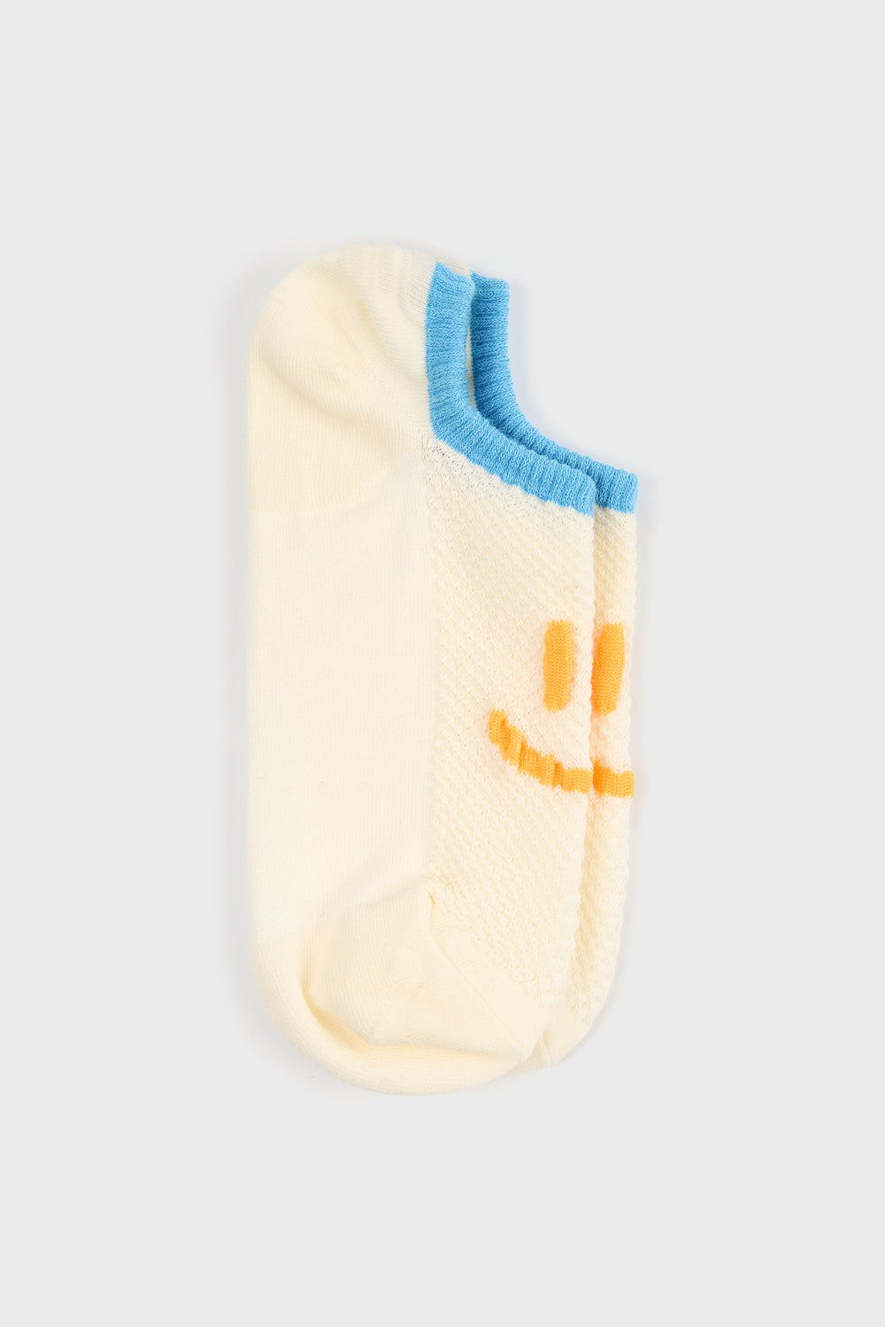 Pale yellow and blue giant smiley face pop socks_5