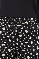 Black and white blotch print satin loose fit trousers_6