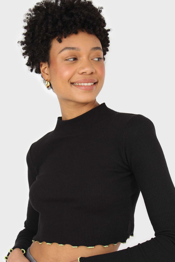 Black and neon ruffle trim cropped top_1