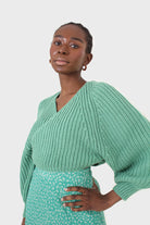 Green cross over balloon sleeve sweater_1