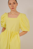 Yellow puff sleeve button back midi dress_6