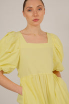 Yellow puff sleeve button back midi dress_11
