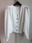 White V-neck pearl button blouse_1