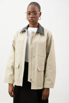 Beige and black vegan leather contrast collar parka_1