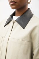 Beige and black vegan leather contrast collar parka_3