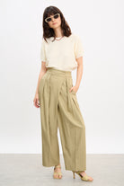 Beige multi pleat side button trousers_4