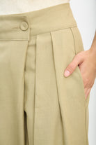 Beige multi pleat side button trousers_3