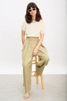 Beige multi pleat side button trousers_5