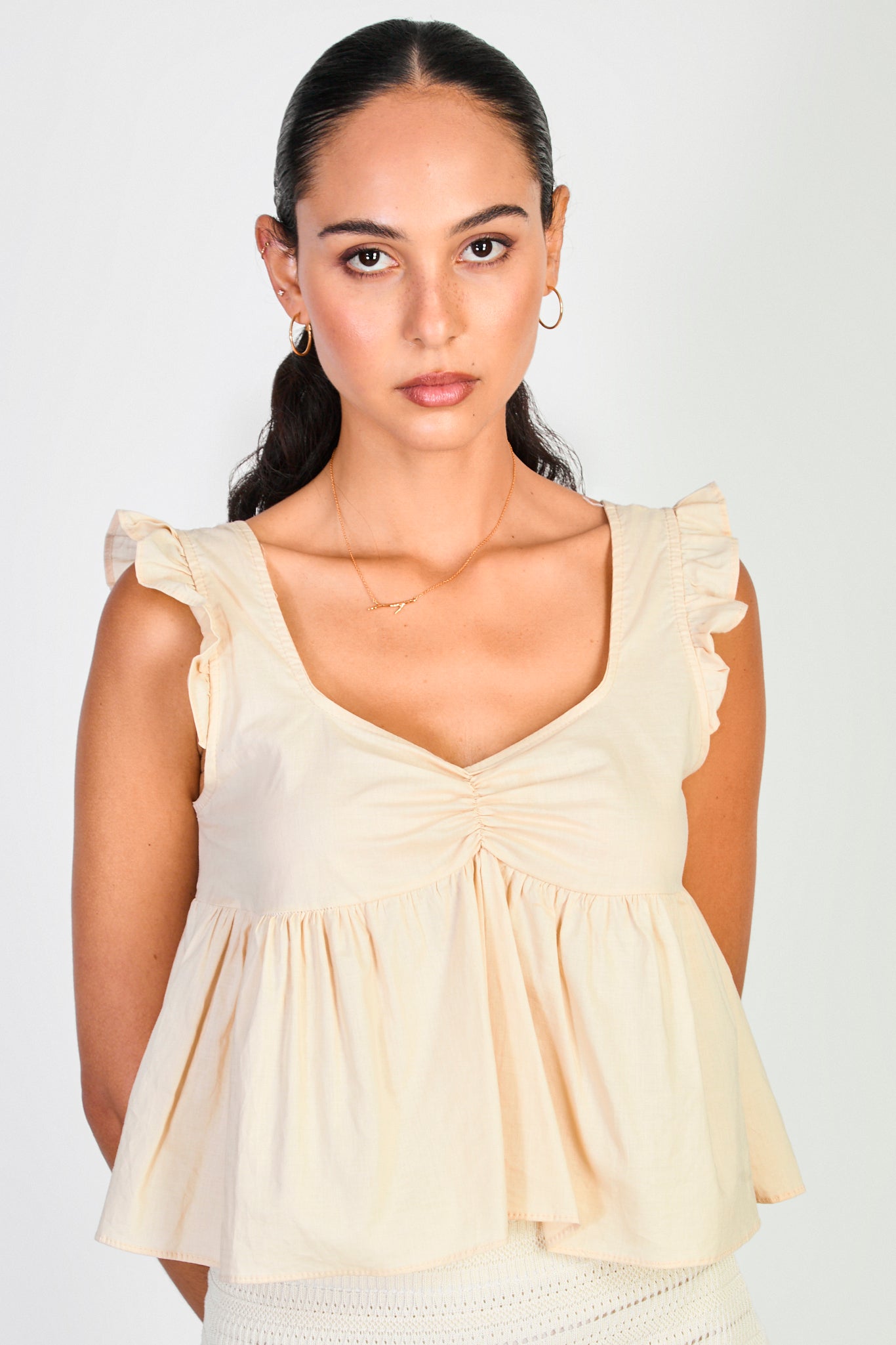 Beige ruffle trim tie back tank_1