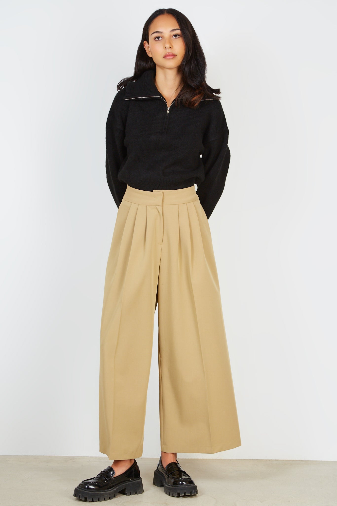 Beige pleated trousers