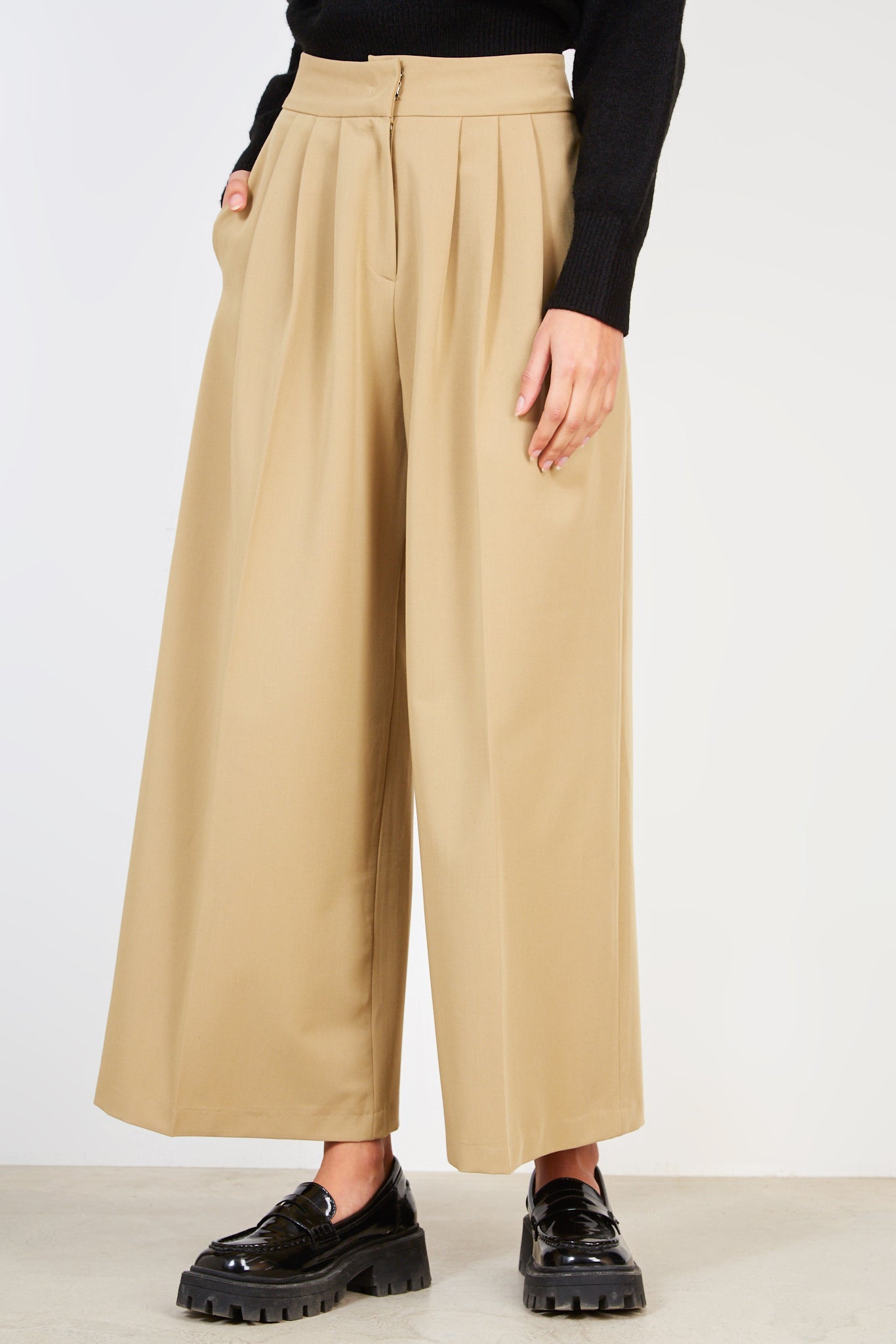 Beige pleated trousers