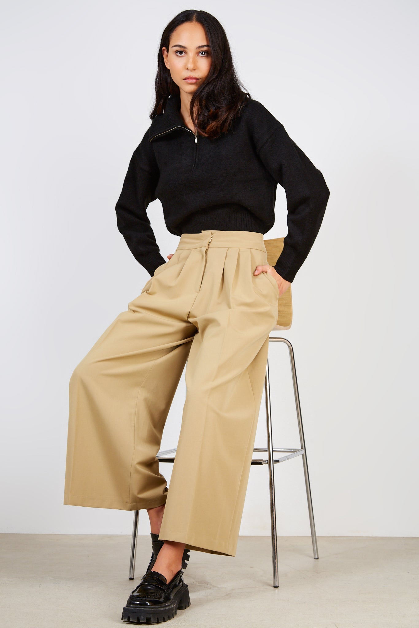 Beige pleated trousers