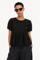 Black textured puff short sleeve tiered blouse_1