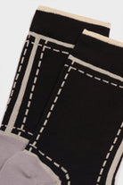 Black and grey dotted outline graphic socks_4