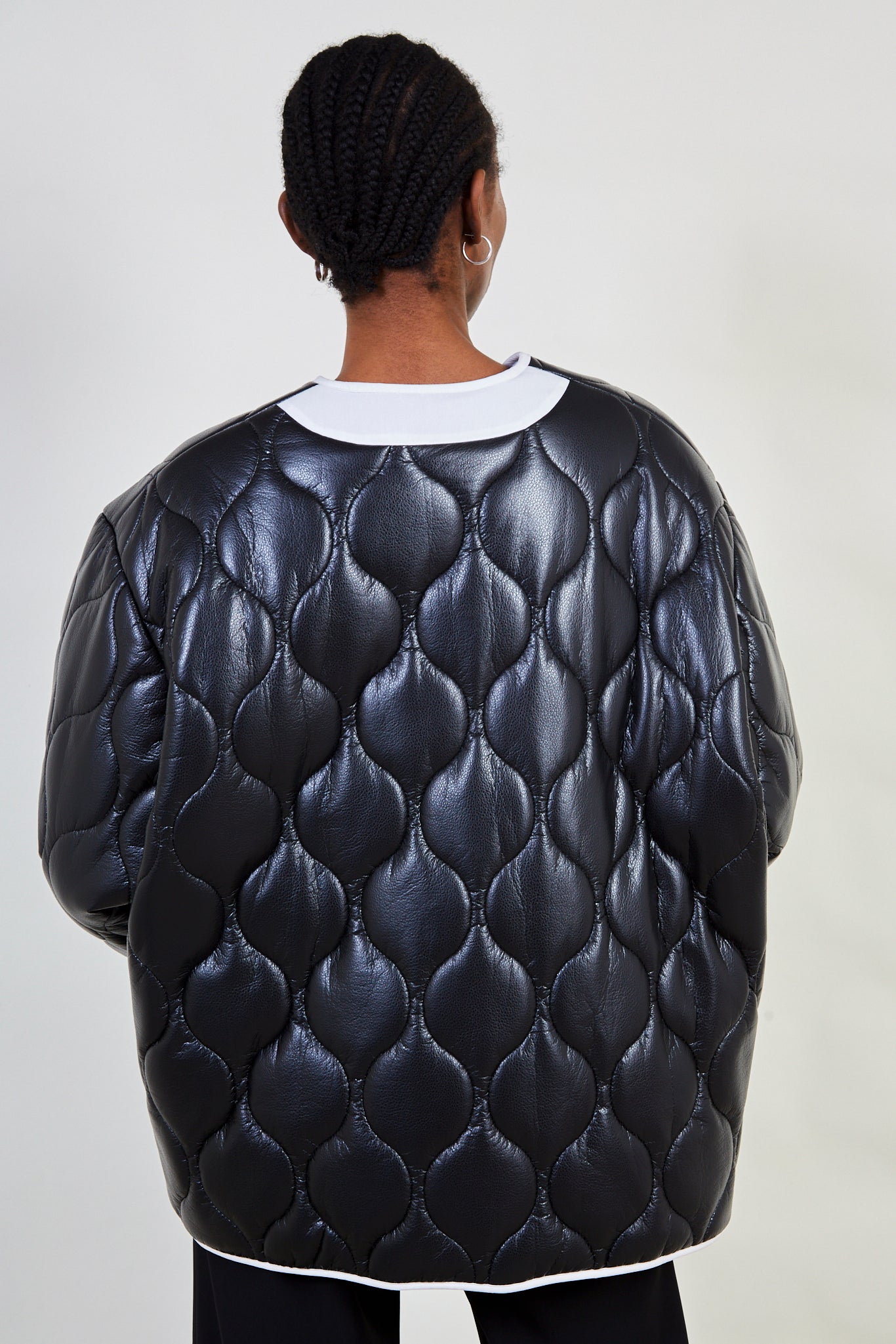 Black and white vegan leather wave stitch coat