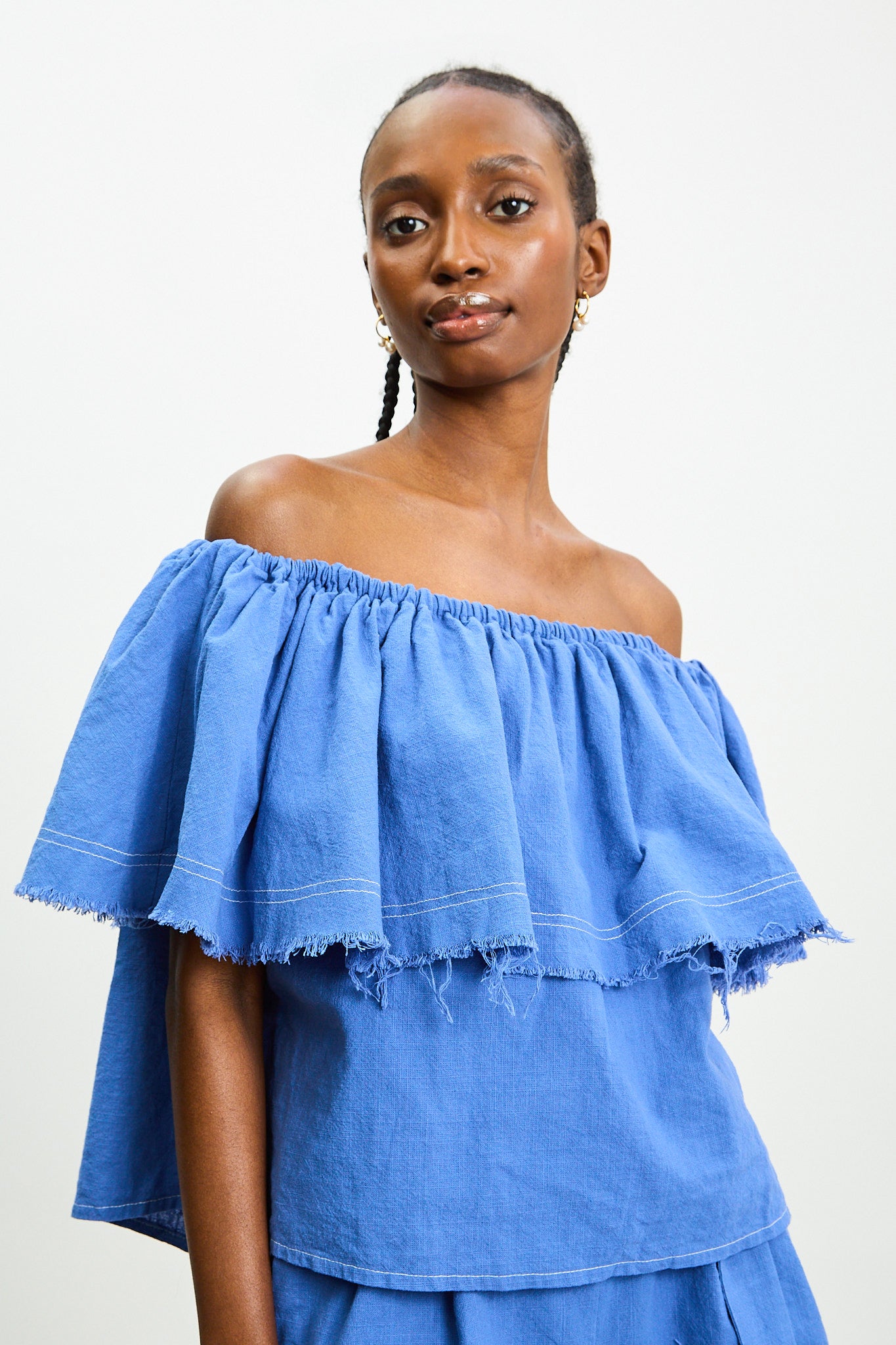 Bright blue contrast stitch raw hem blouse_1