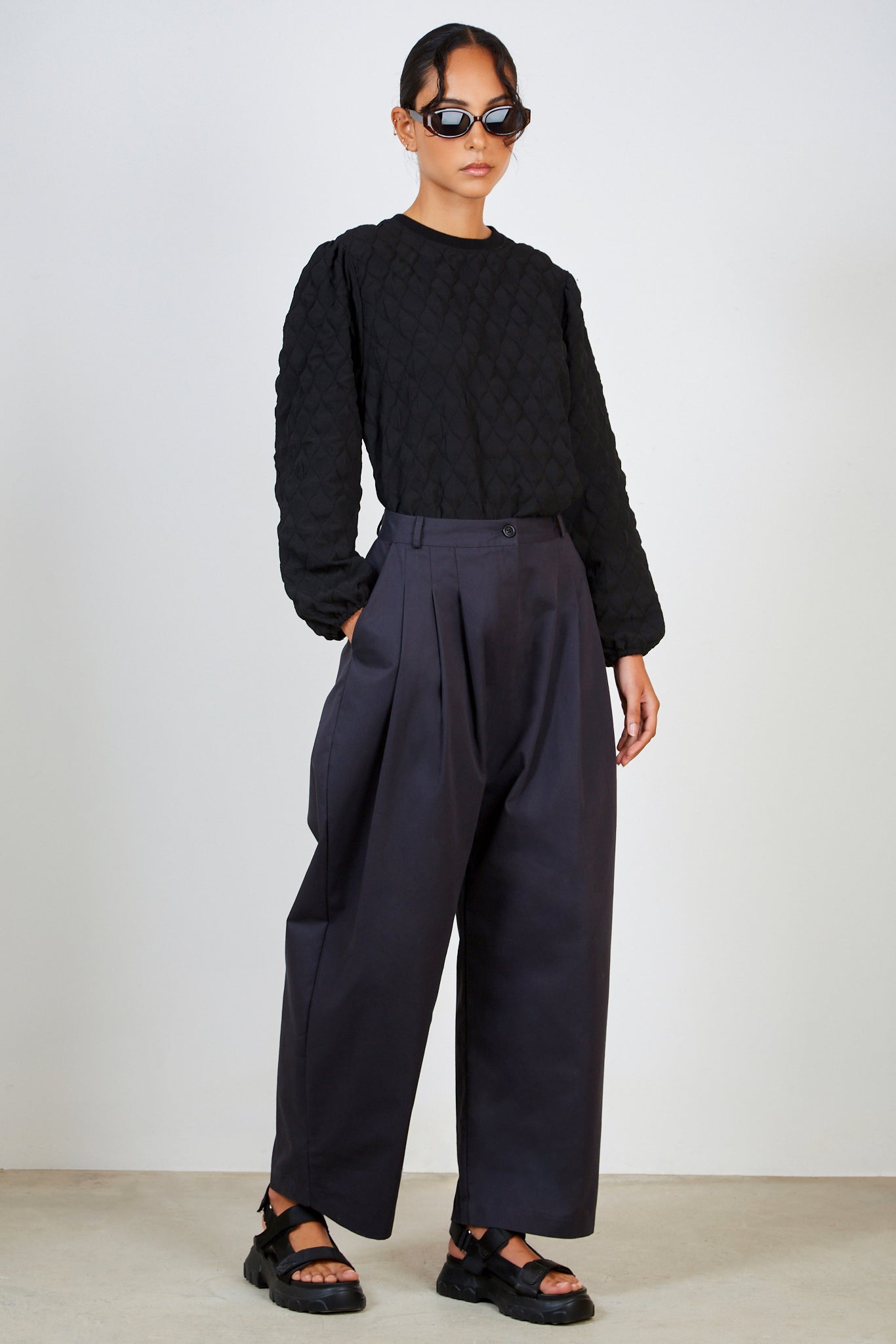 Navy multipleat trousers