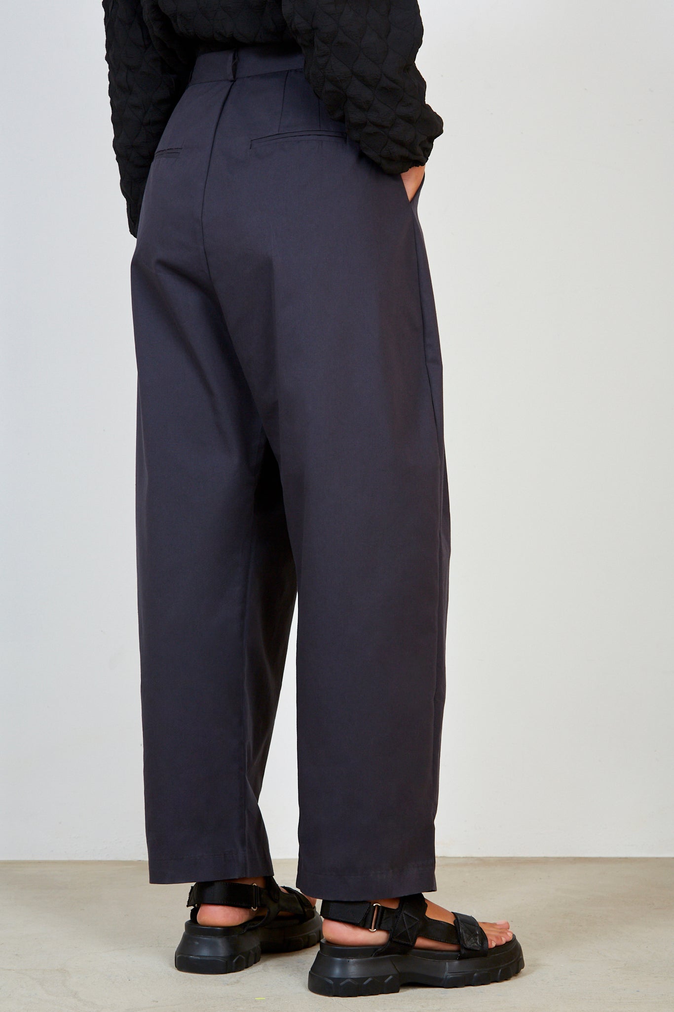 Navy multipleat trousers