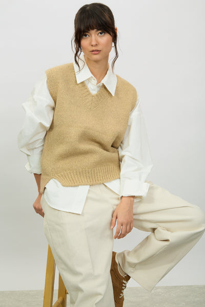 dress sweater vest Ember Black Midi In a blend of cotton and linen this sweater vest unites eight different yarns to achieve its colorful Fair Isle pattern. styling the sweater vest trend