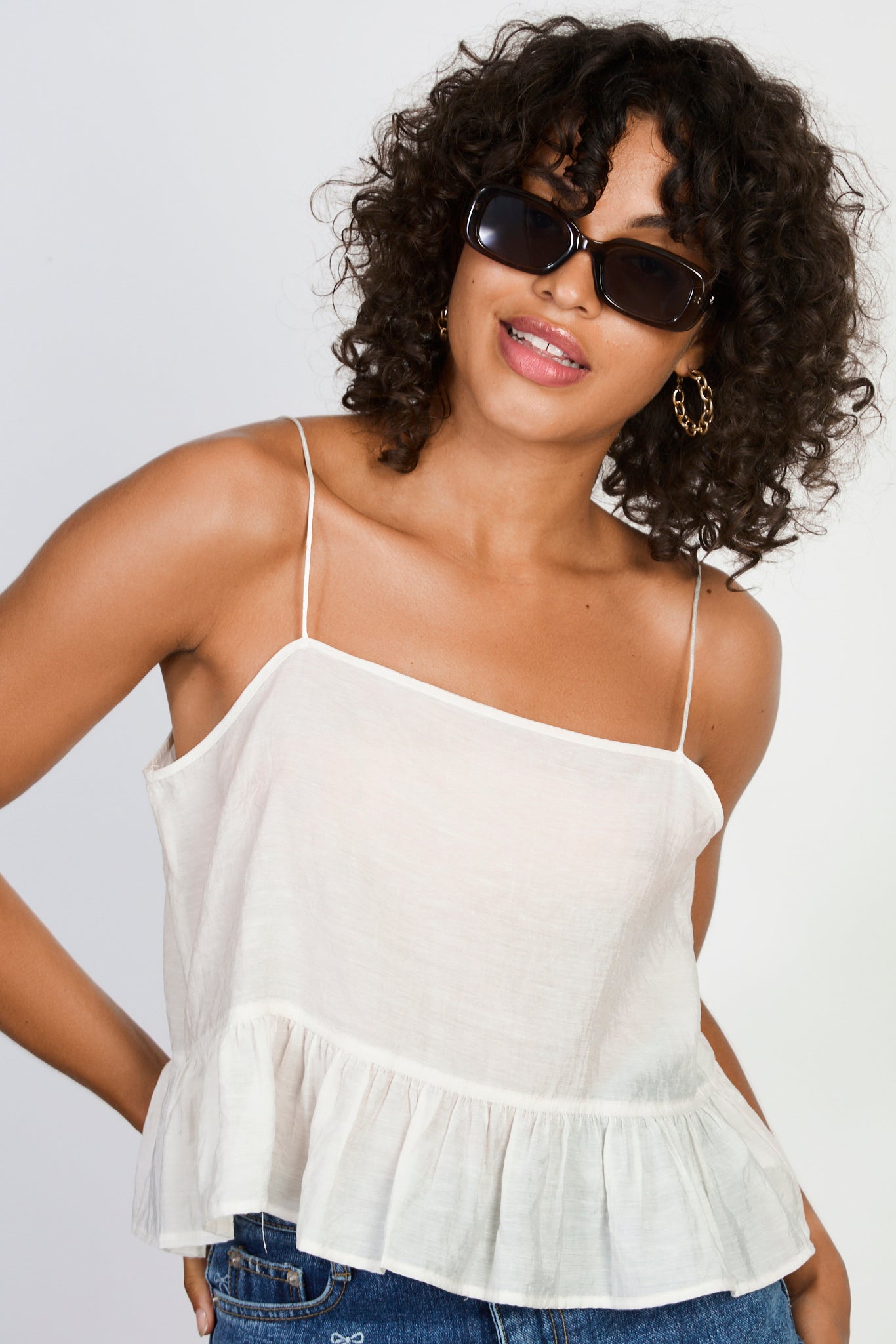 Ivory slim strap ruffle hem tank_1