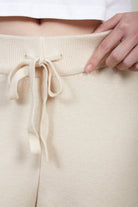 Ivory fuzzy lined thick knit tapered trousers_4