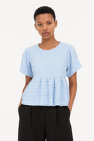 Light blue textured puff short sleeve tiered blouse_1