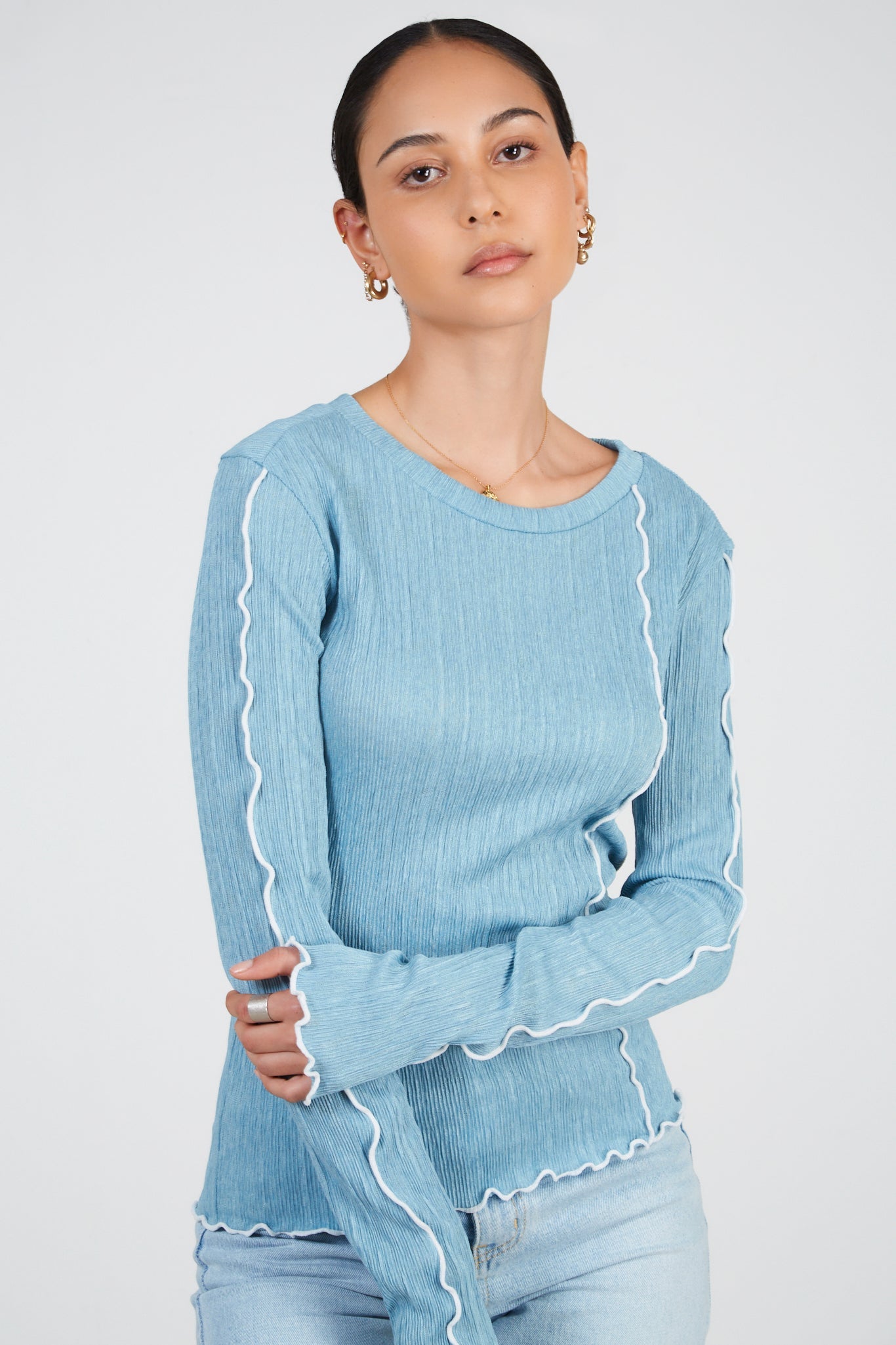 Light blue ribbed white trim top