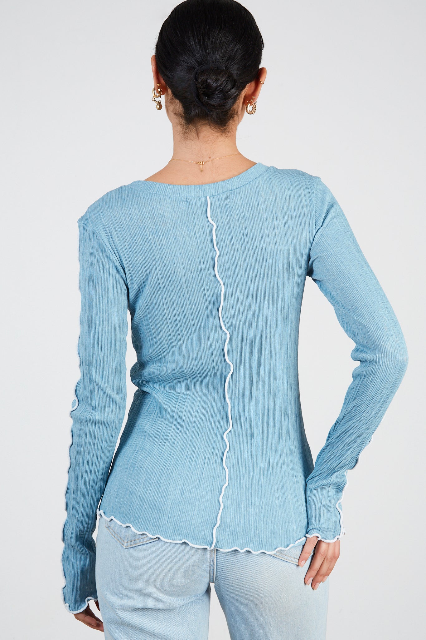 Light blue ribbed white trim top