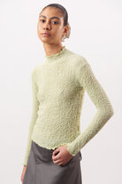 Lime green textured long sleeve mock neck top_1