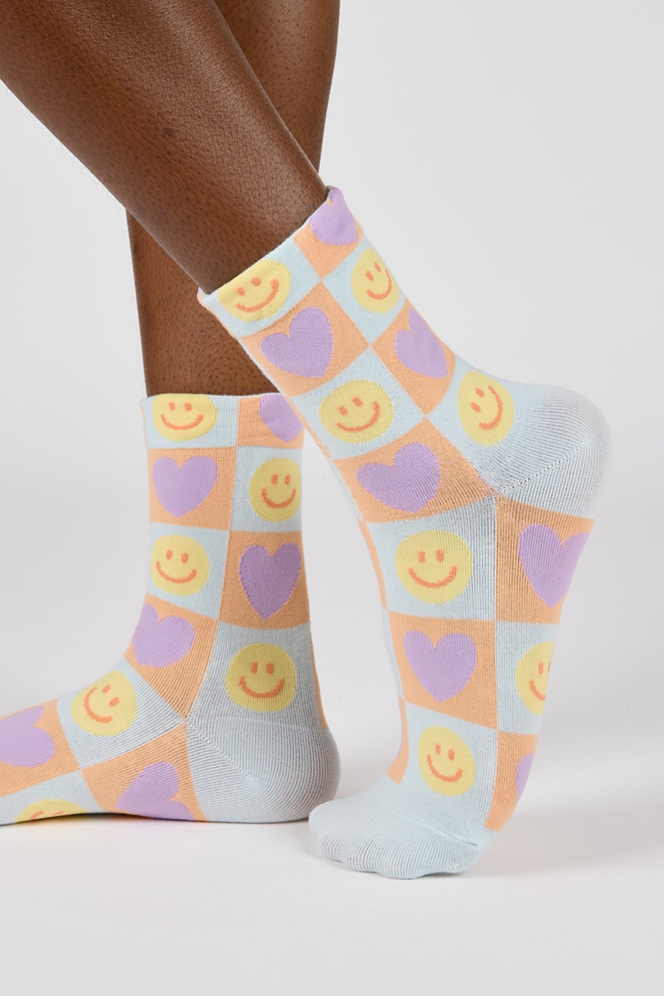 Mint green and peach smiley face heart block socks_1