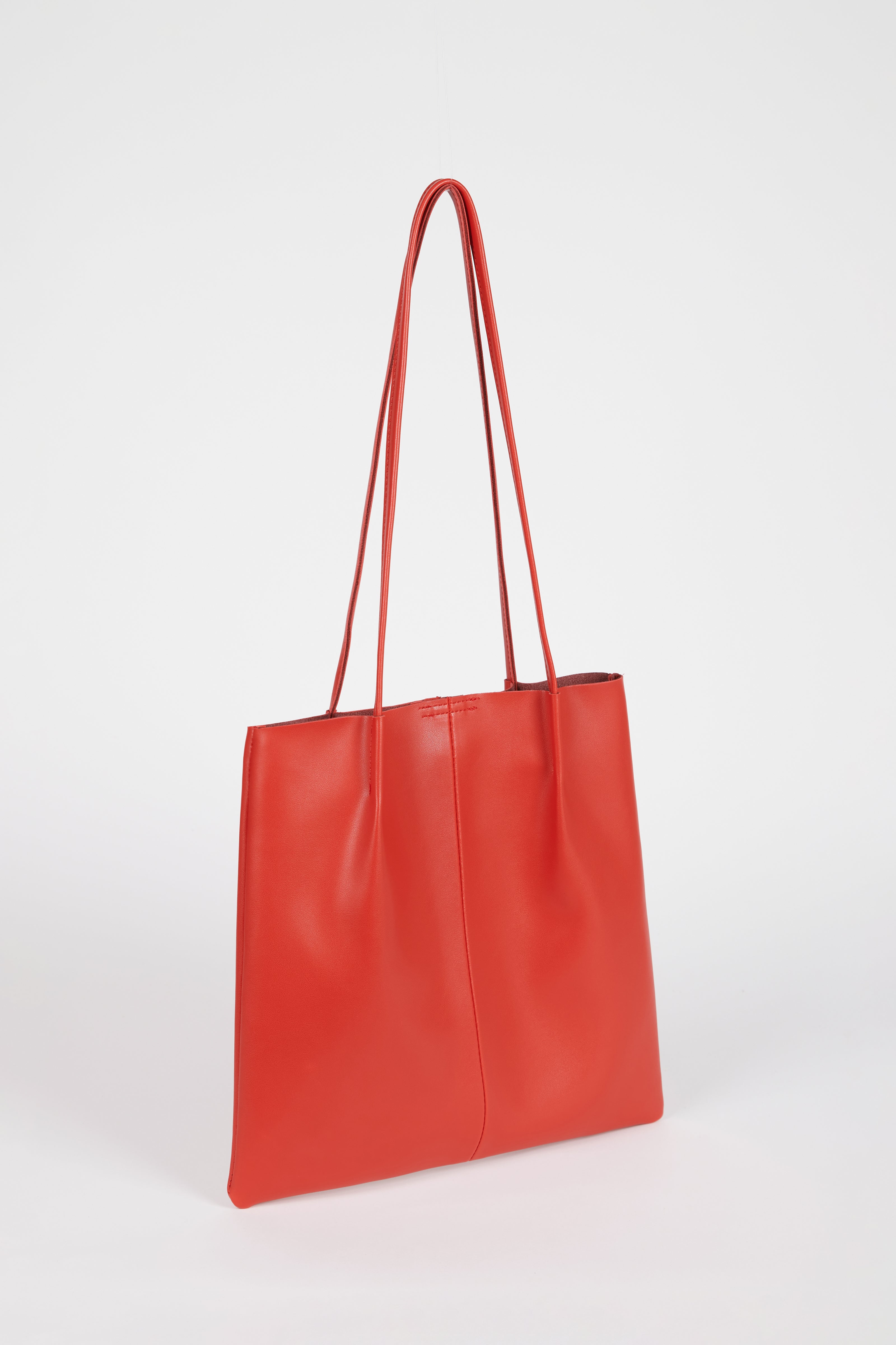 Red orange vegan leather pinched strap tote bag
