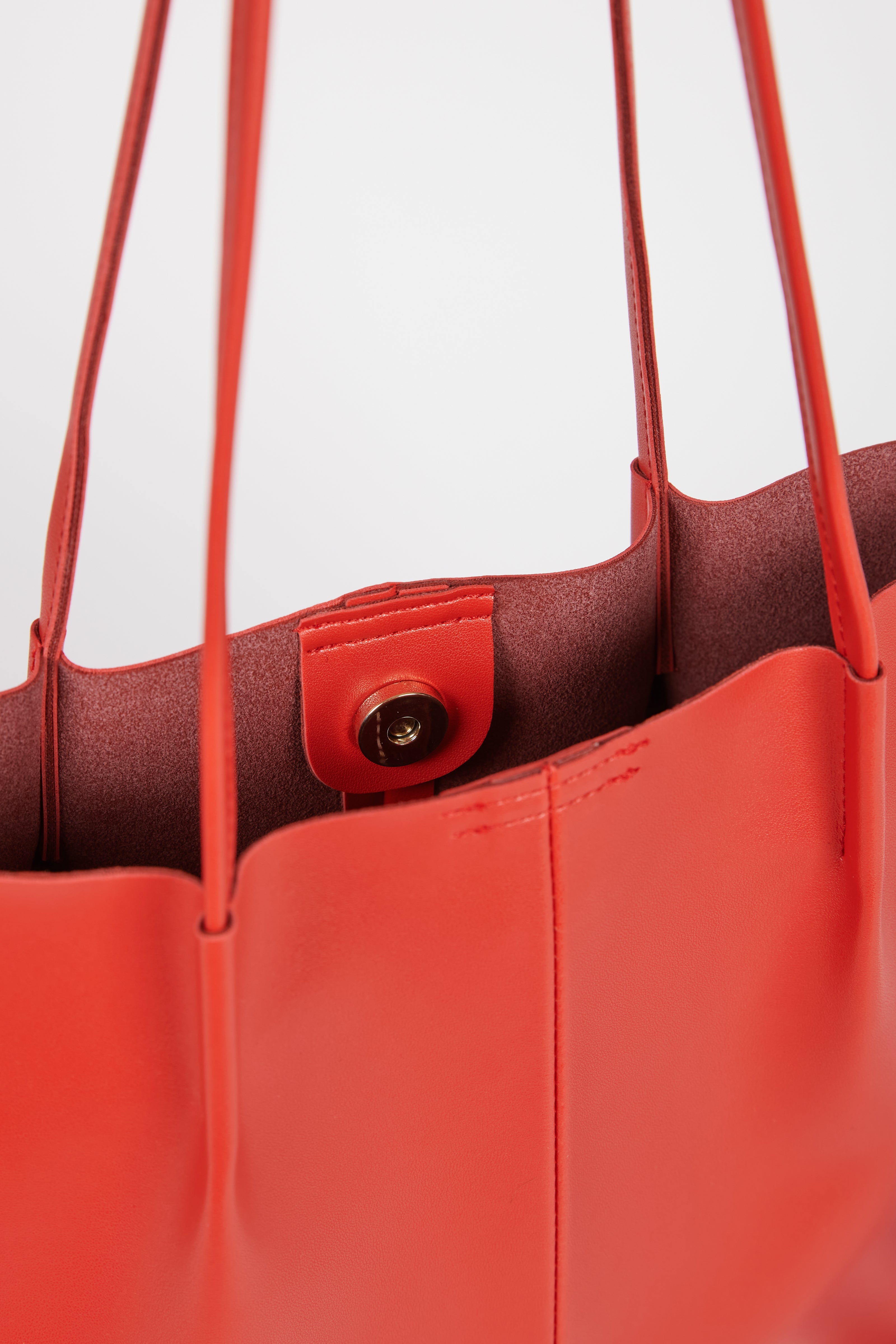 Red orange vegan leather pinched strap tote bag