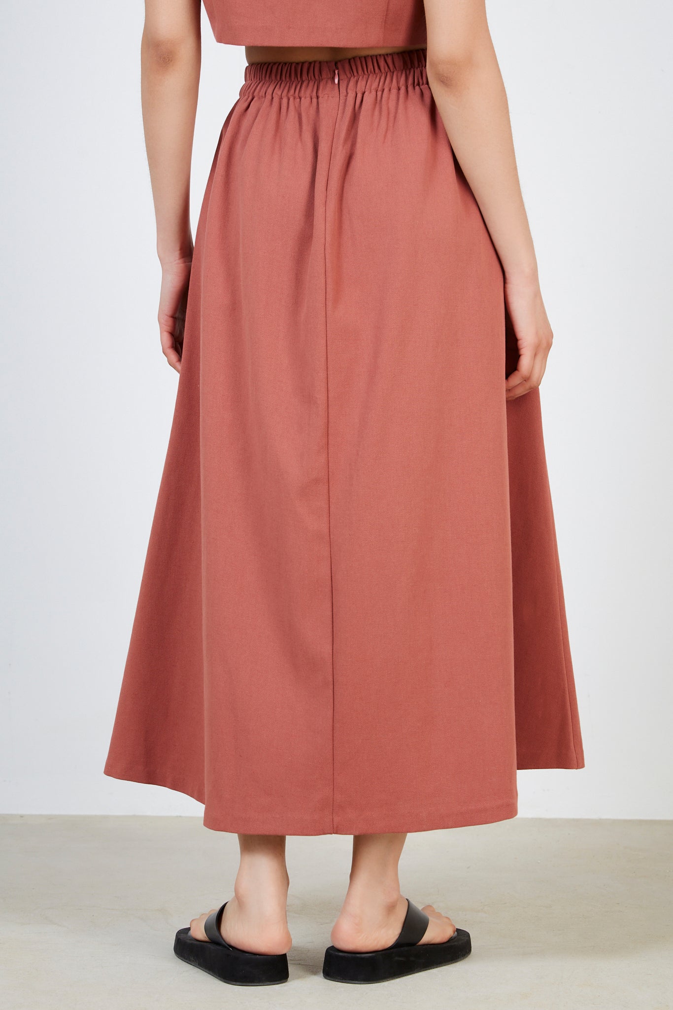 Rust red pleated skirt