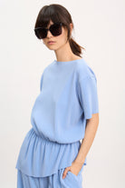 Sky blue ribbed asymmetric hem top_1