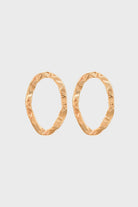 Gold flat hammered oval earrings_1
